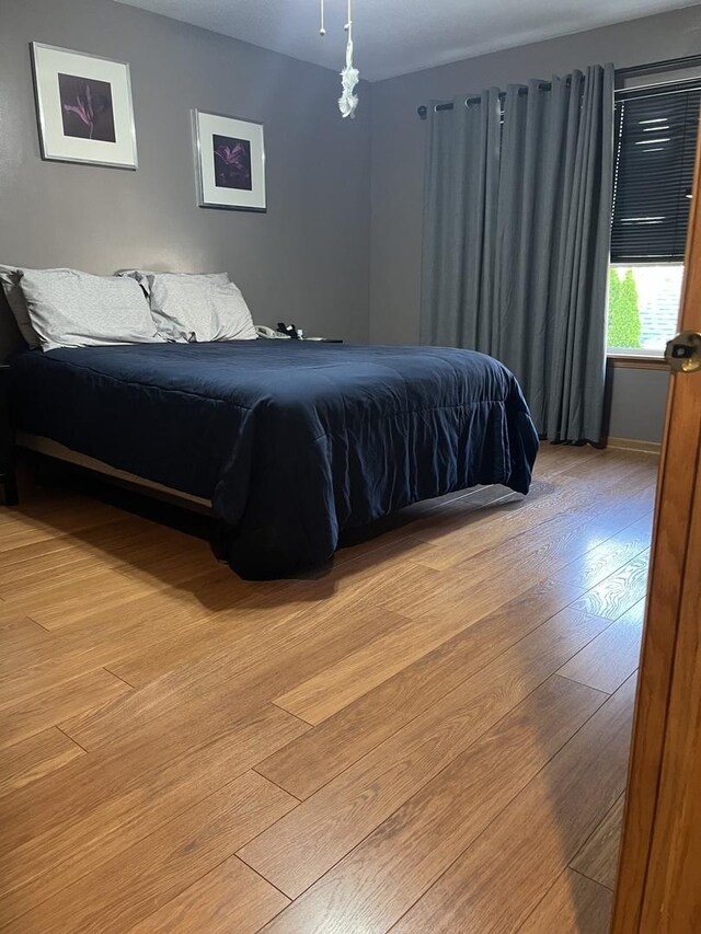 142 Sedgewicke Dr, Romeoville, IL 60446 - bedroom with light wood-style flooring
