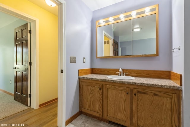 32597 Genoa Rd, Genoa, IL 60135 - bathroom with vanity and wood finished floors