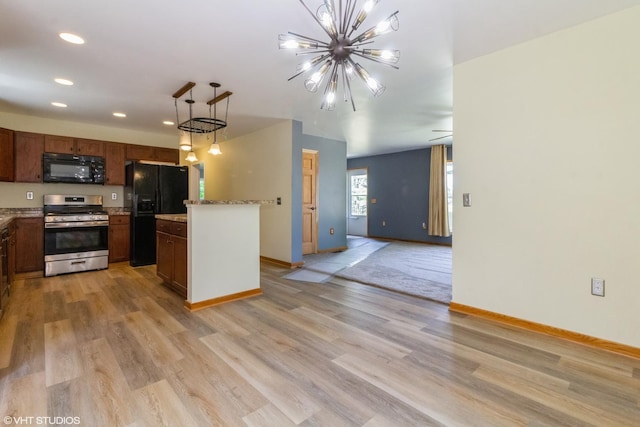 32597 Genoa Rd, Genoa, IL 60135 - kitchen with black appliances, recessed lighting, light wood finished floors, decorative light fixtures, and open floor plan