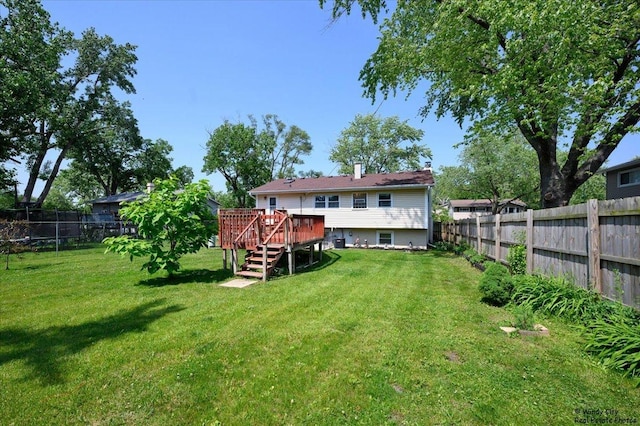 36 W Green Meadows Blvd, Streamwood, IL 60107 - rear view of house with a fenced backyard, a deck, and stairway