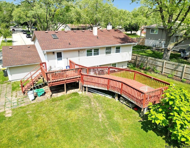 36 W Green Meadows Blvd, Streamwood, IL 60107 - rear view of property featuring a wooden deck, a chimney, and roof with shingles