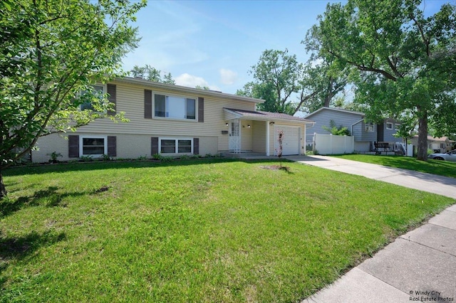 36 W Green Meadows Blvd, Streamwood, IL 60107 - tri-level home with concrete driveway and an attached garage