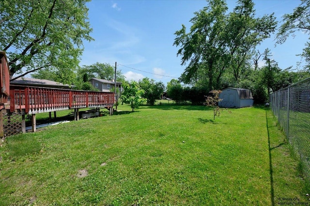 36 W Green Meadows Blvd, Streamwood, IL 60107 - fenced backyard with a deck and a storage unit
