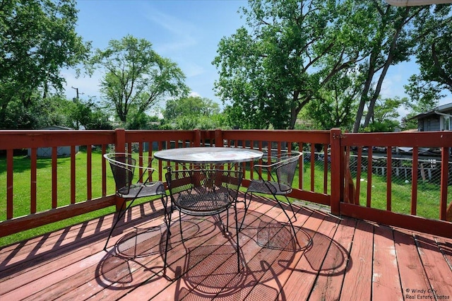 36 W Green Meadows Blvd, Streamwood, IL 60107 - wooden deck featuring outdoor dining space and a lawn