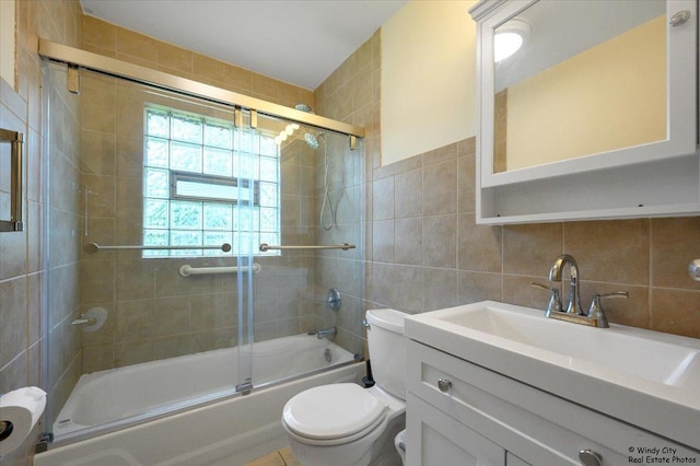 36 W Green Meadows Blvd, Streamwood, IL 60107 - full bathroom with combined bath / shower with glass door, tile walls, vanity, and backsplash