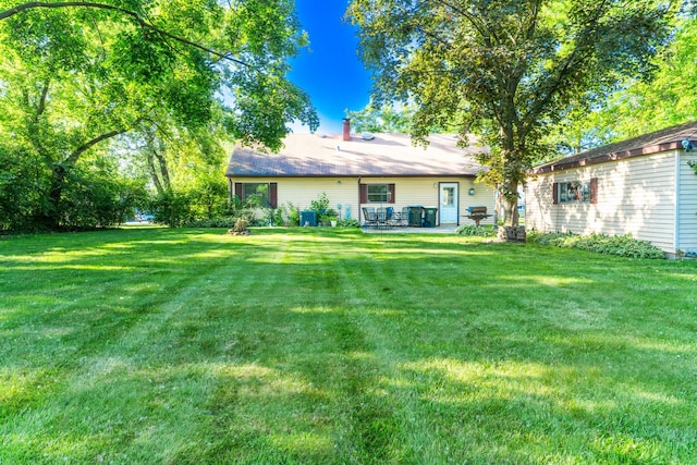 1333 W 59th St, La Grange Highlands, IL 60525 - view of green lawn featuring a patio