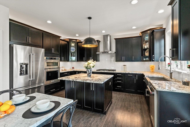 3578 Doral Dr, Elgin, IL 60124 - kitchen with stainless steel appliances, wall chimney range hood, decorative backsplash, glass insert cabinets, and recessed lighting