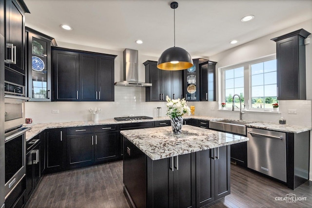 3578 Doral Dr, Elgin, IL 60124 - kitchen with appliances with stainless steel finishes, wall chimney range hood, dark cabinetry, dark wood finished floors, and recessed lighting