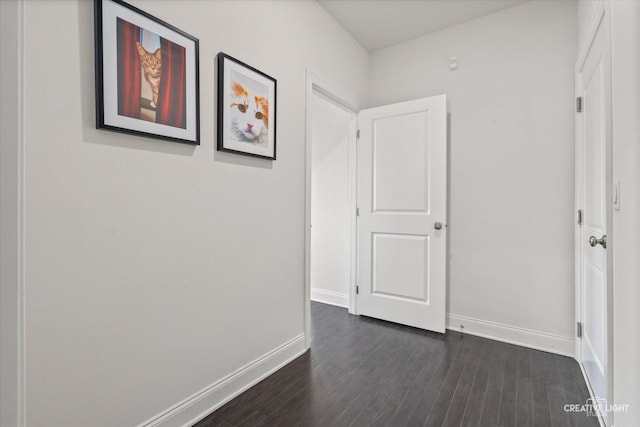 3578 Doral Dr, Elgin, IL 60124 - hallway featuring baseboards and dark wood-type flooring