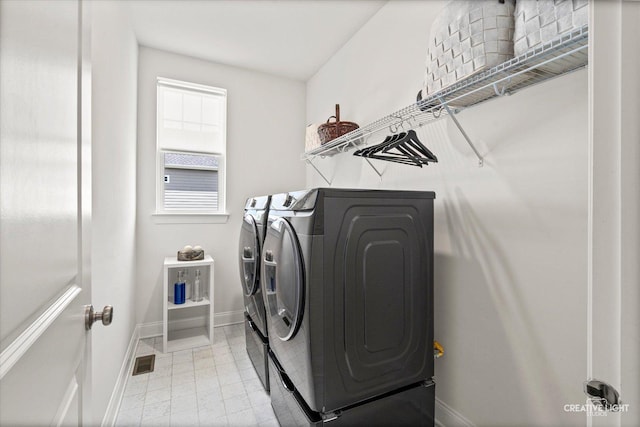 3578 Doral Dr, Elgin, IL 60124 - washroom featuring washing machine and dryer and baseboards