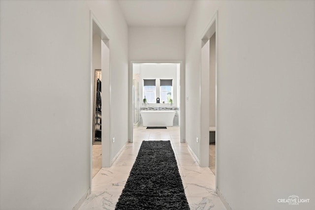 3578 Doral Dr, Elgin, IL 60124 - hallway featuring light marble finish floors