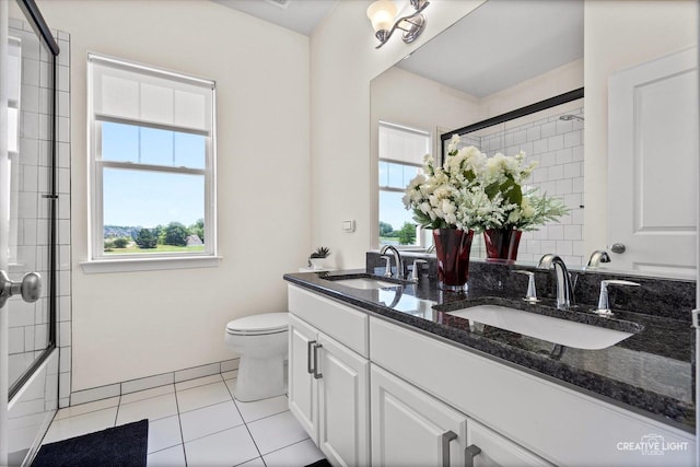 3578 Doral Dr, Elgin, IL 60124 - bathroom featuring double vanity, tile patterned flooring, and bath / shower combo with glass door