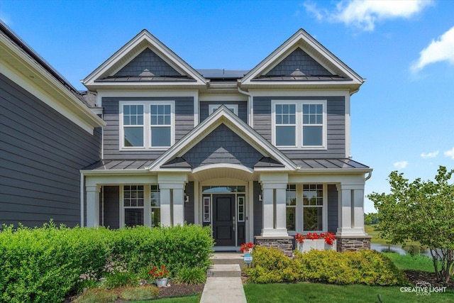 3578 Doral Dr, Elgin, IL 60124 - craftsman-style home featuring a standing seam roof, a metal roof, and roof mounted solar panels