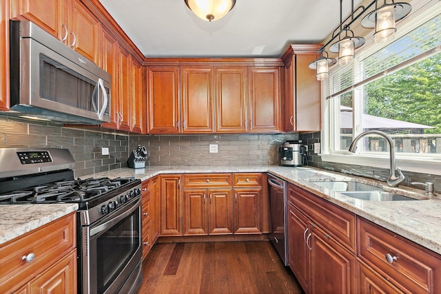 2165 Greystone Pl, Hoffman Estates, IL 60169 - kitchen featuring appliances with stainless steel finishes, dark wood finished floors, light stone countertops, and brown cabinetry