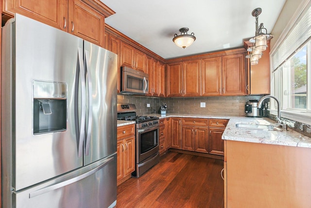 2165 Greystone Pl, Hoffman Estates, IL 60169 - kitchen featuring stainless steel appliances, dark wood-style flooring, brown cabinets, and backsplash
