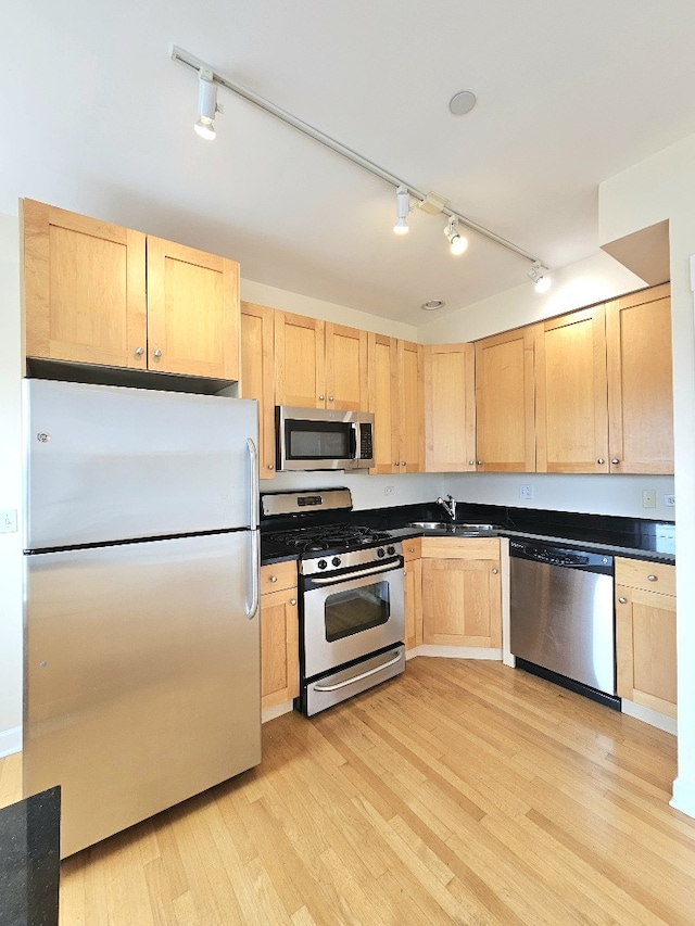 2537.5 Prairie Ave Unit 3N, Evanston, IL 60201 - kitchen with appliances with stainless steel finishes, light brown cabinetry, rail lighting, and light wood-type flooring