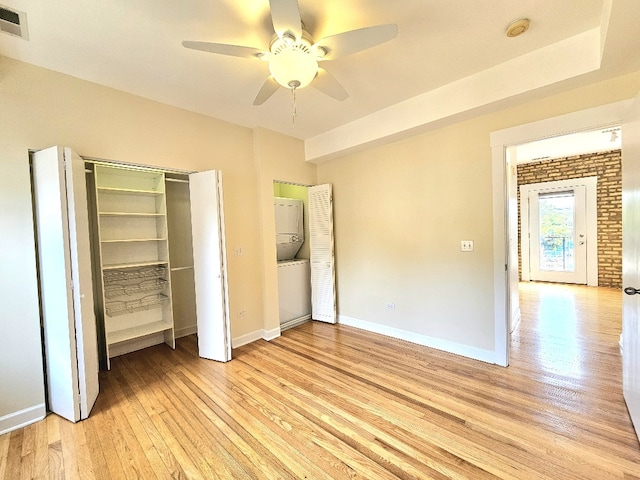 2537.5 Prairie Ave Unit 3N, Evanston, IL 60201 - unfurnished bedroom featuring stacked washer / drying machine, light wood-style flooring, and ceiling fan