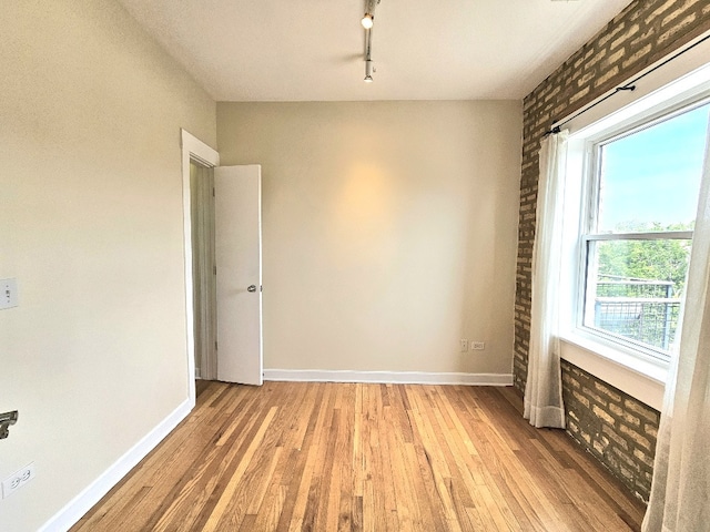 2537.5 Prairie Ave Unit 3N, Evanston, IL 60201 - empty room with light wood finished floors and track lighting