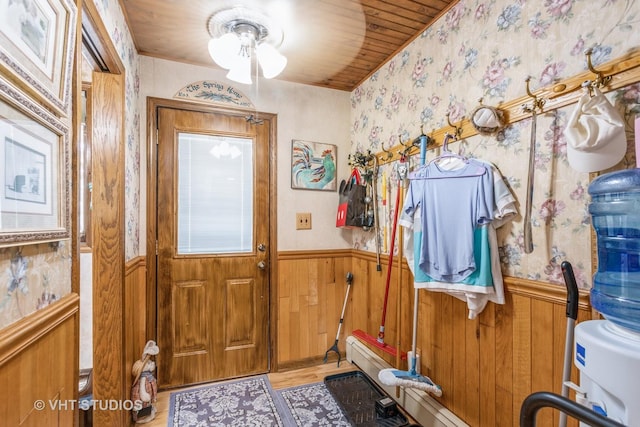 14119 W Maple Rd, Mokena, IL 60448 - doorway featuring wainscoting, wallpapered walls, a ceiling fan, and wooden ceiling