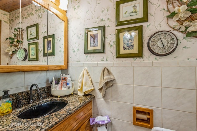 14119 W Maple Rd, Mokena, IL 60448 - bathroom featuring wallpapered walls, vanity, tile walls, and wainscoting