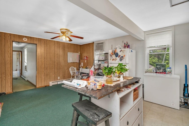 107 N Elm St, Gardner, IL 60424 - kitchen with freestanding refrigerator, ceiling fan, wooden walls, a baseboard heating unit, and a wall mounted air conditioner