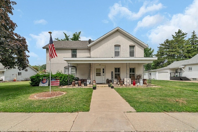 107 N Elm St, Gardner, IL 60424 - townhome / multi-family property featuring covered porch, a front lawn, and brick siding