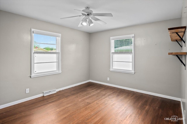 306 Hillside Pl, North Aurora, IL 60542 - empty room with healthy amount of natural light, wood finished floors, and ceiling fan