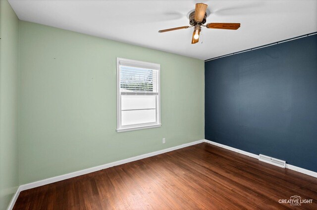 306 Hillside Pl, North Aurora, IL 60542 - unfurnished room with dark wood-style flooring and ceiling fan