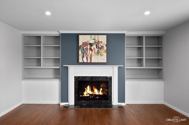 306 Hillside Pl, North Aurora, IL 60542 - unfurnished living room featuring a high end fireplace, wood finished floors, built in shelves, and recessed lighting