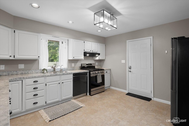 306 Hillside Pl, North Aurora, IL 60542 - kitchen featuring stainless steel gas range, dishwasher, under cabinet range hood, freestanding refrigerator, and light countertops
