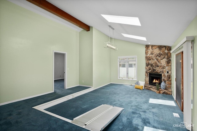 306 Hillside Pl, North Aurora, IL 60542 - unfurnished living room featuring carpet, a skylight, a fireplace, beam ceiling, and high vaulted ceiling