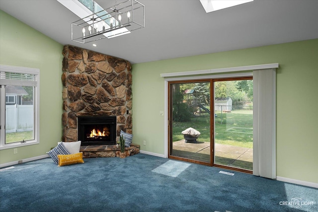 306 Hillside Pl, North Aurora, IL 60542 - unfurnished living room featuring carpet floors, a fireplace, healthy amount of natural light, and vaulted ceiling