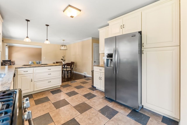 2040 Poplar Ave, Hanover Park, IL 60133 - kitchen with stainless steel refrigerator with ice dispenser, stove, decorative light fixtures, crown molding, and light stone counters