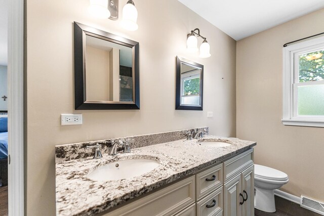 2040 Poplar Ave, Hanover Park, IL 60133 - bathroom with plenty of natural light, double vanity, tile patterned flooring, and ensuite bathroom