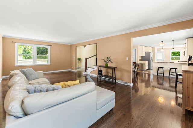 2040 Poplar Ave, Hanover Park, IL 60133 - living area featuring stairs, dark wood finished floors, healthy amount of natural light, and crown molding