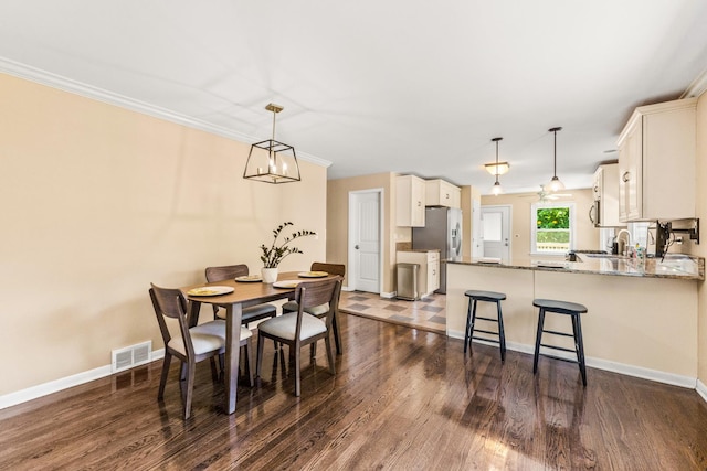 2040 Poplar Ave, Hanover Park, IL 60133 - dining room with dark wood finished floors and a chandelier