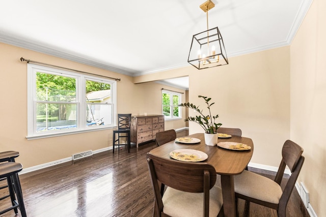 2040 Poplar Ave, Hanover Park, IL 60133 - dining area featuring ornamental molding, a chandelier, and dark wood finished floors