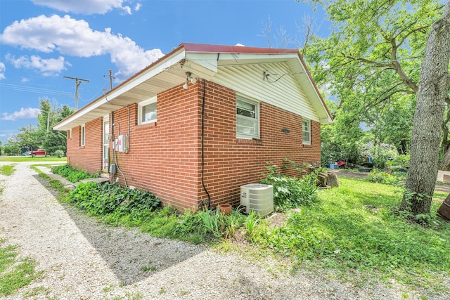 319 N Third St, Fisher, IL 61843 - view of side of home featuring brick siding and driveway