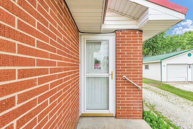 319 N Third St, Fisher, IL 61843 - property entrance with a garage and brick siding