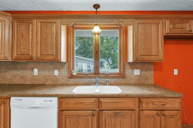 319 N Third St, Fisher, IL 61843 - kitchen with white dishwasher, decorative backsplash, hanging light fixtures, and brown cabinets