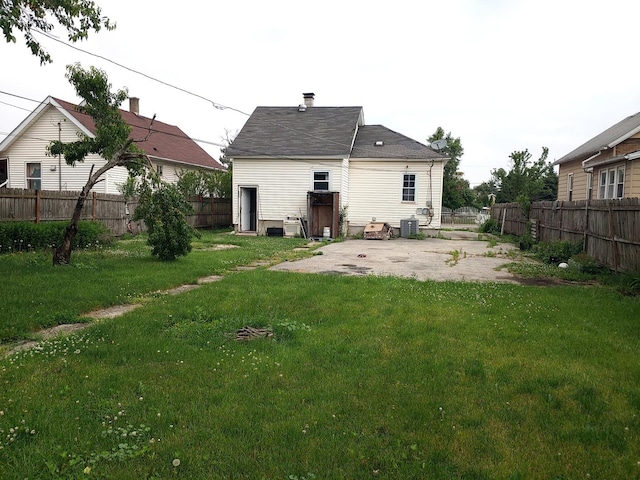 back of house with a patio and a fenced backyard