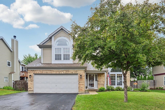 1643 Warrington Ln, Crystal Lake, IL 60014 - view of front facade featuring brick siding, driveway, a garage, and roof with shingles