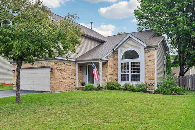 1643 Warrington Ln, Crystal Lake, IL 60014 - view of front facade with brick siding, asphalt driveway, an attached garage, and roof with shingles