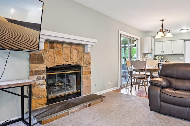 1643 Warrington Ln, Crystal Lake, IL 60014 - carpeted living area featuring a fireplace and a chandelier