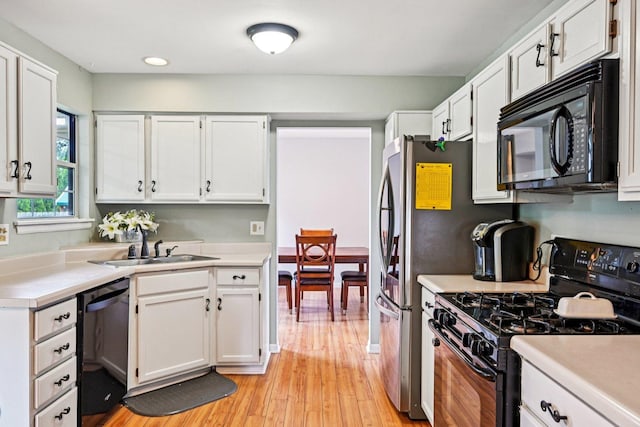 1643 Warrington Ln, Crystal Lake, IL 60014 - kitchen featuring black appliances, light countertops, white cabinetry, light wood-type flooring, and recessed lighting