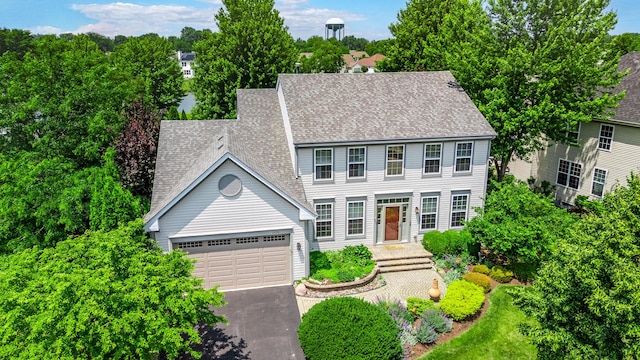 1639 Brower Pl, Sycamore, IL 60178 - colonial house featuring a shingled roof, driveway, and an attached garage