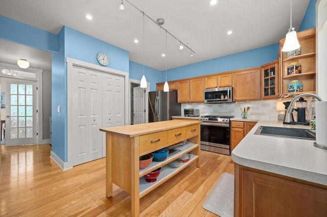 1639 Brower Pl, Sycamore, IL 60178 - kitchen featuring appliances with stainless steel finishes, open shelves, a center island, butcher block countertops, and tasteful backsplash