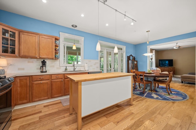 1639 Brower Pl, Sycamore, IL 60178 - kitchen with wood counters, light wood-type flooring, stainless steel electric range oven, open floor plan, and tasteful backsplash
