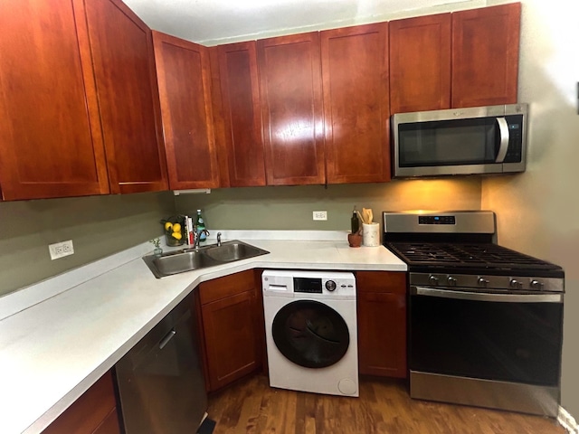 629 Garfield St Unit 1N, Oak Park, IL 60304 - kitchen with washer / clothes dryer, appliances with stainless steel finishes, light countertops, dark wood-style flooring, and reddish brown cabinets