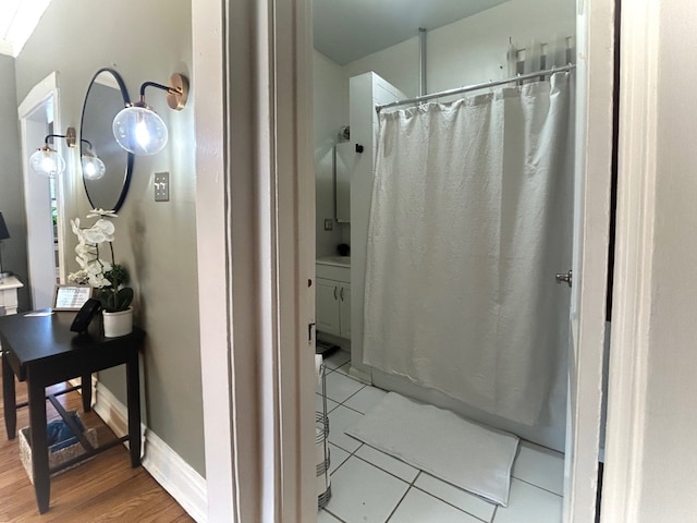 629 Garfield St Unit 1N, Oak Park, IL 60304 - full bathroom featuring a shower with curtain and wood finished floors